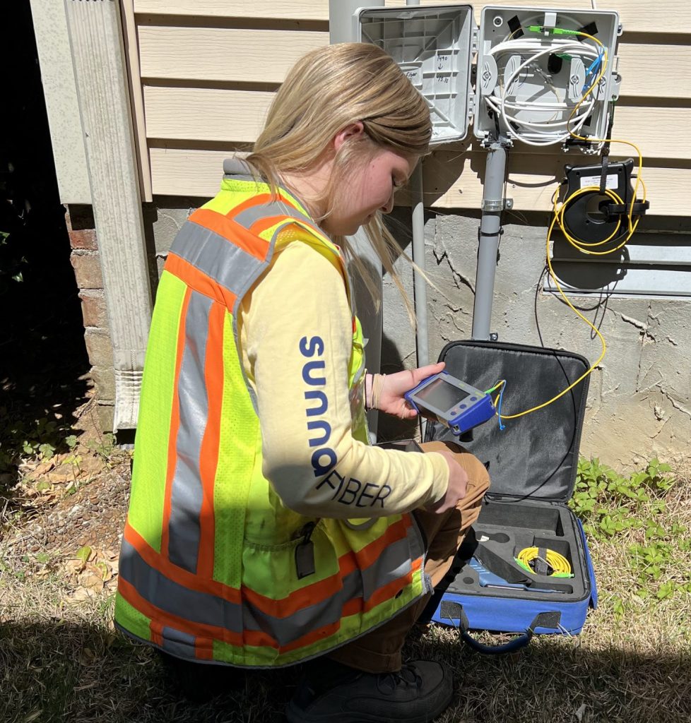 Fiber optic technician testing connection.